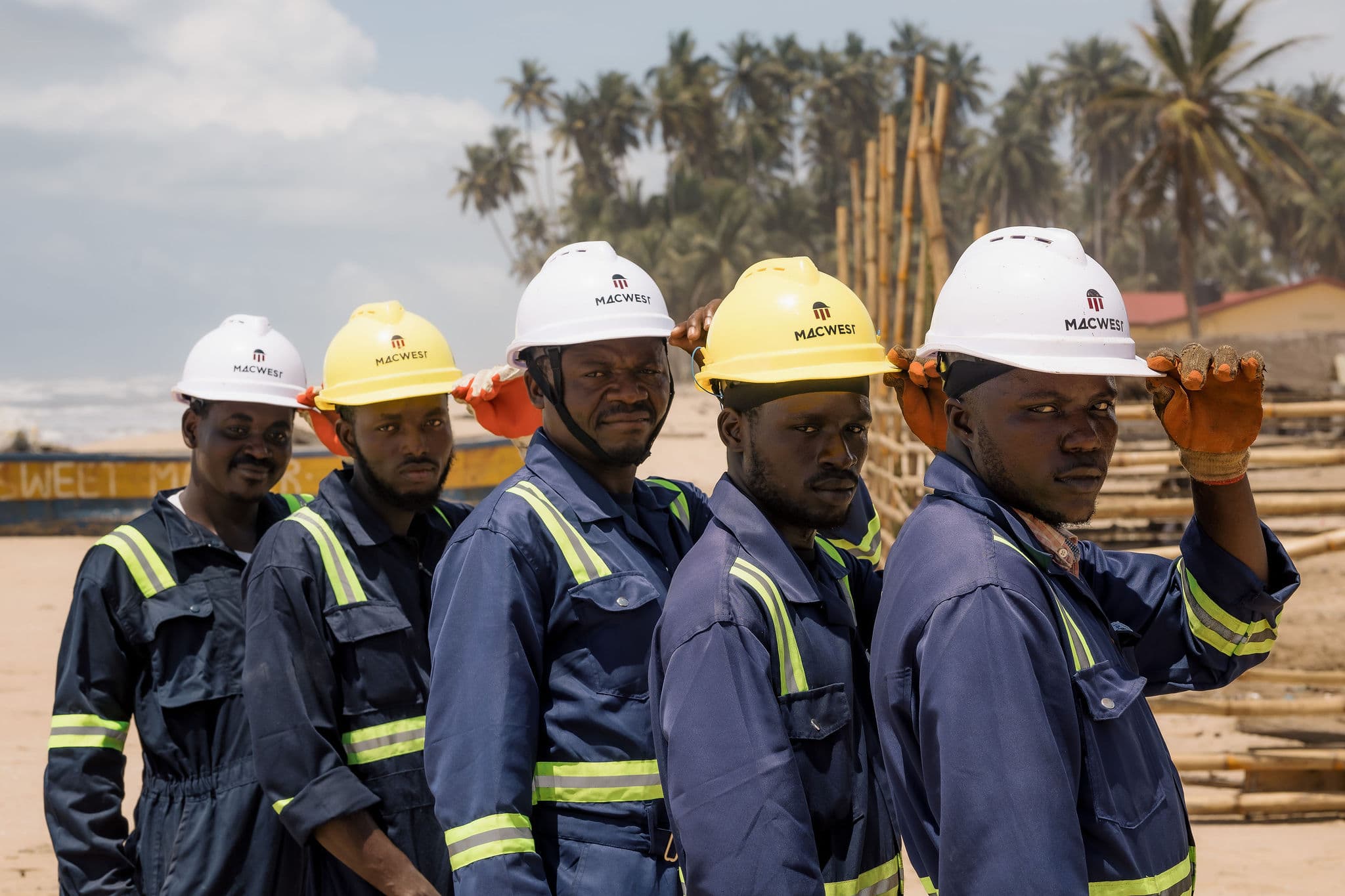 Workers on scaffolding following safety protocols